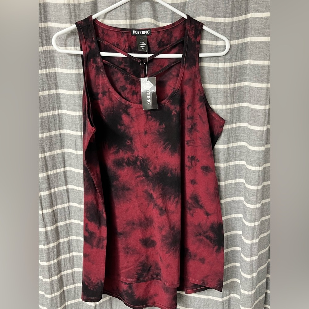 New. Never worn, with cut-out tank top.